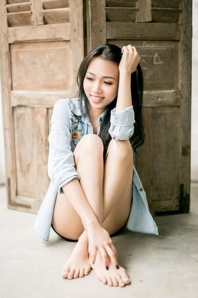 Vietnamese girl sitting on the floor